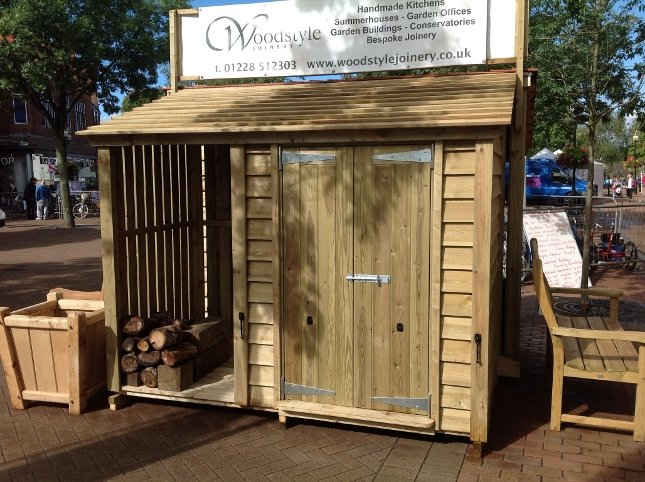 Wooden bike shed and log store