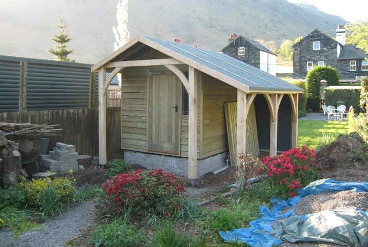 Shed with log store